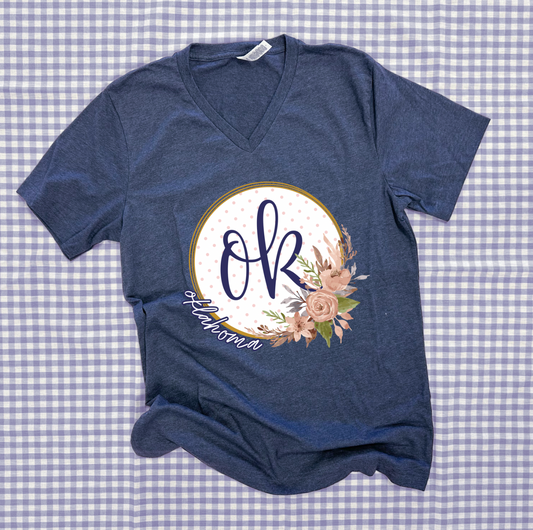 OKLAHOMA 2025: OK Script Floral Wreath With *Gold Shimmer* (BELLA CANVAS VNECK)