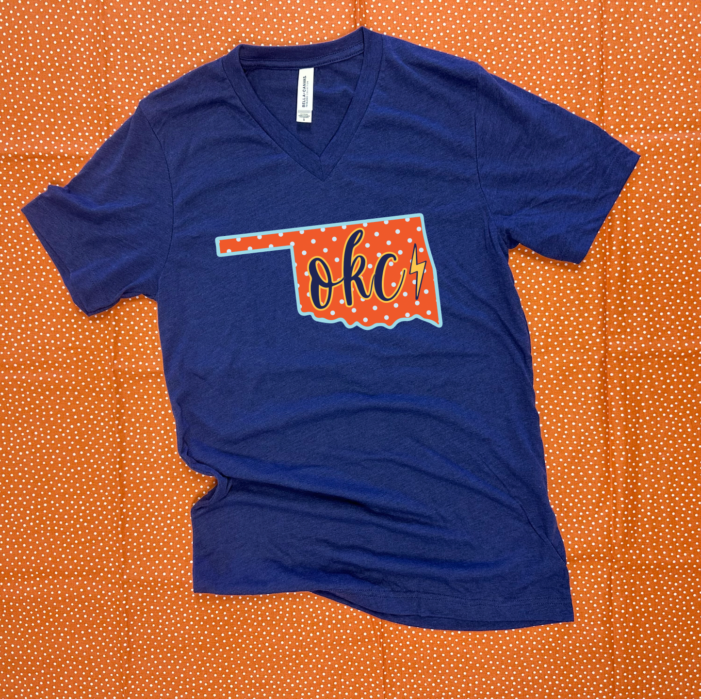 OKC SPIRIT 2025: Oklahoma State Shape "OKC" Script (VNECK)